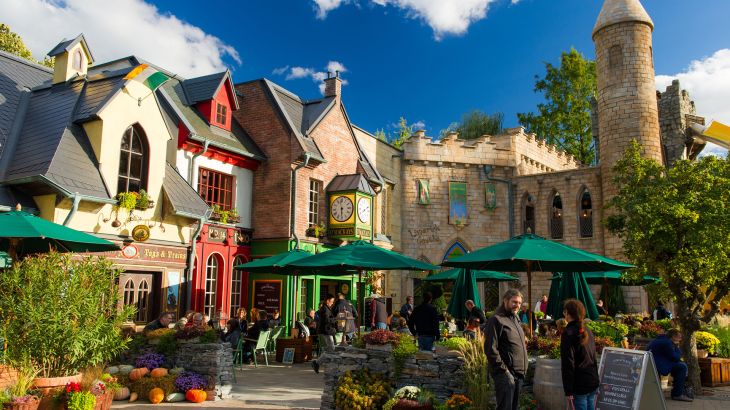 The house facade of the new Ireland themed area with plenty of seating and flowering plants.